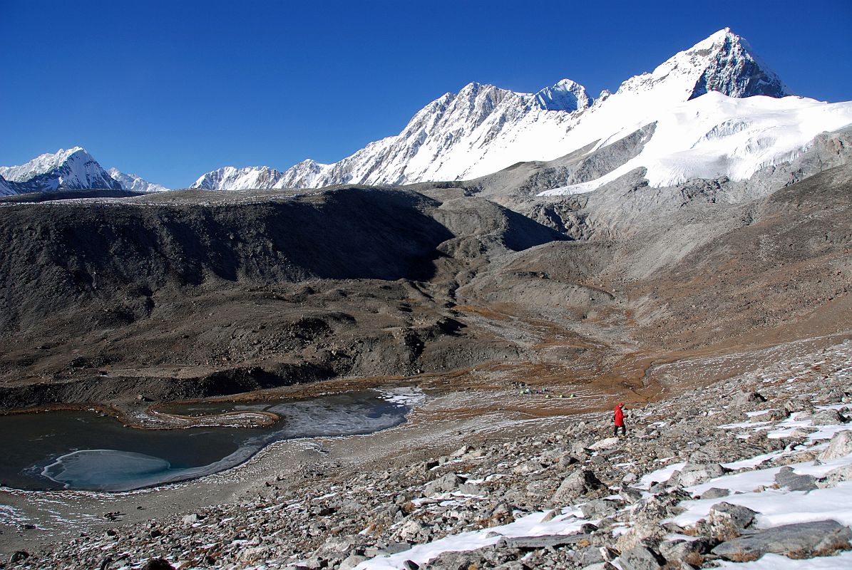 23 Shishapangma Southwest Base Camp With View Of Goldum, Risum, Shishapangma, Pungpa Ri and Nyanang Ri We finally reach Shishapangma Southwest Base Camp (5276m) with the view of Goldum, Risum, Shishapangma, Pungpa Ri and Nyanang Ri. The ABC used by the 1982 British expedition was a �friendly place in a little hollow amongst grass and boulders� a short distance above the top end of the lake.